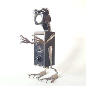 The &quot;Antenna Robot&quot; sculpture assemblage of repurposed vintage Japanese transmitter, camera parts and silverware