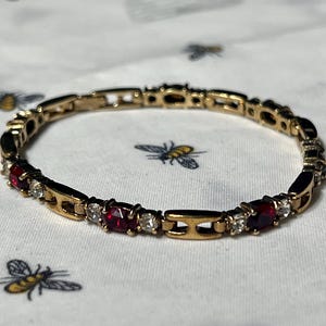 Vintage Gold-Tone Bracelet with Red Gem and Rhinestone Accents