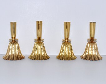 Austrian Secessionist Brass Fluted Bell Formed Candlestick Holders with a Light- Catching Had Hammered Surface, Set of 4