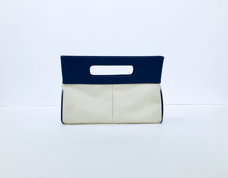 navy and cream clutch bag