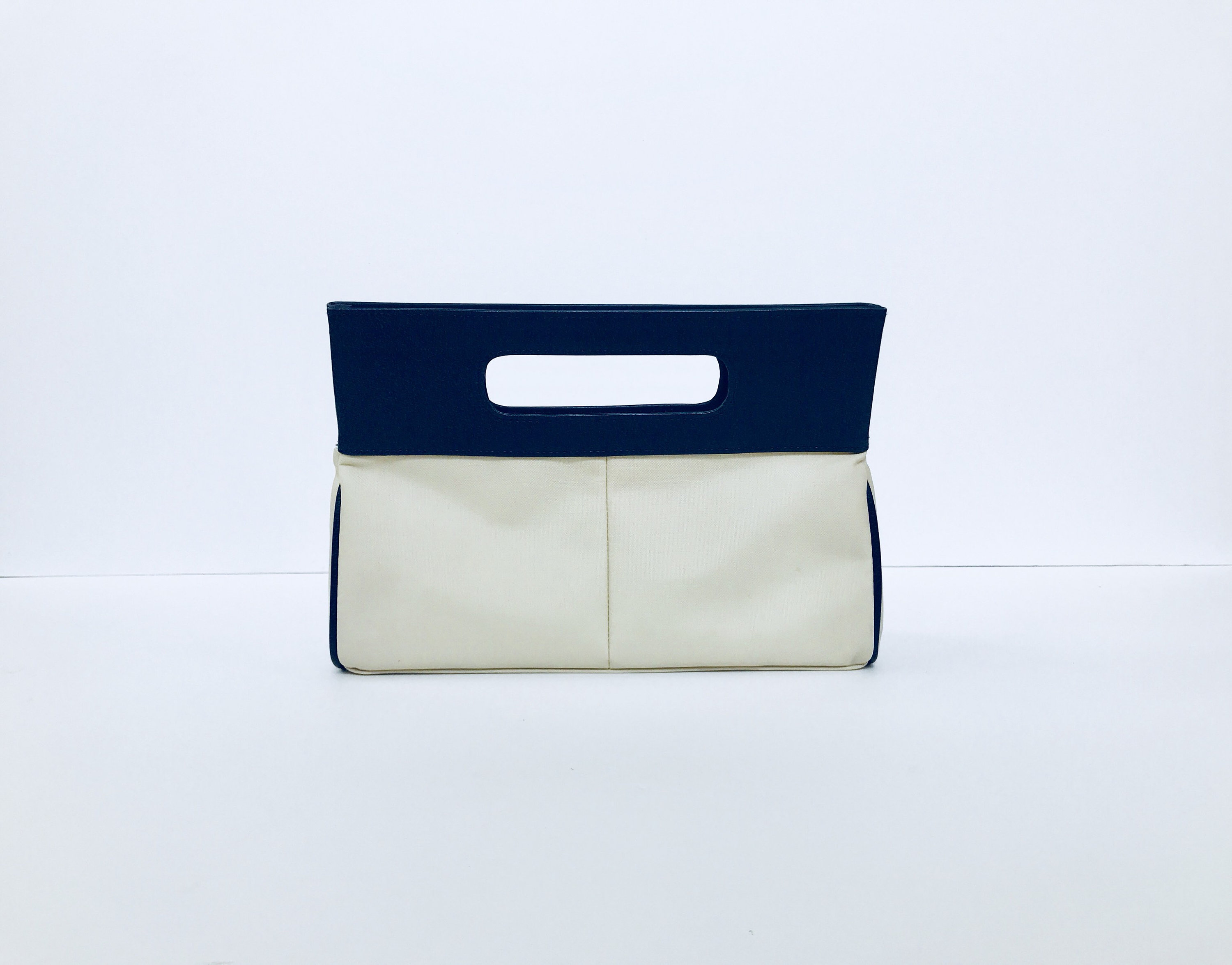 navy and cream handbags
