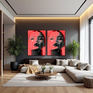 May include: Two framed art prints featuring a stylized face with a red and black color scheme. The artwork has a modern, digital aesthetic, with lines and geometric shapes. The prints are displayed above a brown sofa in a contemporary living room setting.