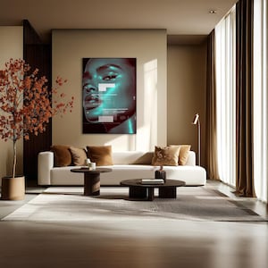 May include: A modern living room featuring a white sofa with brown throw pillows, two dark wooden coffee tables, and a large framed artwork of a woman's face with teal accents. A potted tree with orange leaves adds a natural touch.