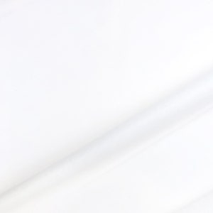 May include: A plain white fabric background with a subtle diagonal crease.
