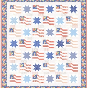 May include: A patriotic quilt featuring a repeating pattern of American flags and star shapes in red, white, and blue. The flags have a floral pattern on the flag portion. The quilt is bordered with a floral pattern on a blue background.