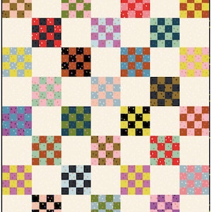 May include: A patchwork quilt featuring a repeating pattern of checkered squares in various colors, including red, blue, green, and yellow. The squares are set against a cream-colored background with small white star-shaped accents. The quilt is a mix of warm and cool tones.