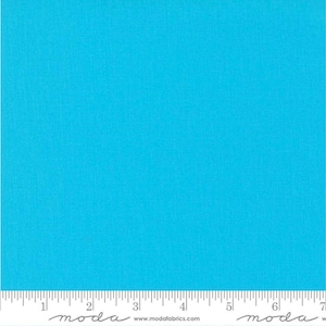 May include: A solid turquoise blue fabric swatch with the text "moda" written in cursive at the bottom of the swatch. The fabric has a subtle texture.