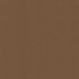 May include: A close-up of a brown fabric with a woven texture. The color is a warm, earthy tone, and the weave creates a subtle grid pattern across the surface. The fabric appears to be a solid color.