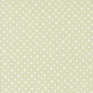 May include: Light green fabric with a repeating pattern of white dots and small white house shapes. The fabric has a subtle texture and a soft, muted color palette, suitable for various craft projects.