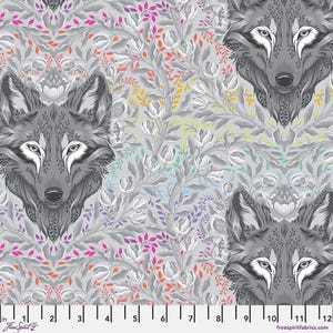 May include: A gray fabric with a repeating pattern of wolf faces and floral elements. The wolves are detailed with white accents, set against a backdrop of gray foliage with pops of pink, orange, yellow, and purple. The fabric is 12 inches wide.