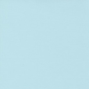 May include: A solid light blue fabric with a subtle textured weave. The color is a soft, pastel hue, reminiscent of the sky on a clear day. The fabric appears to be a plain weave, suitable for various crafting projects.