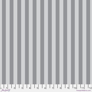 May include: A fabric with a vertical stripe pattern in shades of gray. The stripes alternate between light and medium gray, creating a simple yet visually appealing design. The image includes a ruler along the bottom edge, with markings in inches.