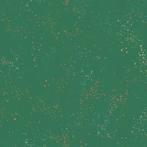 May include: A solid dark green fabric featuring a scattered pattern of small, irregular paint-like splatters in shades of light peach, soft blue, and muted white, creating a textured, speckled appearance across the entire surface of the material.