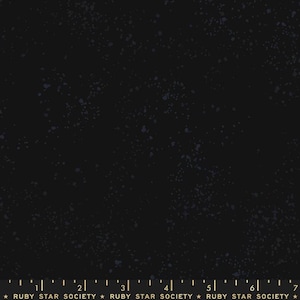 May include: Black fabric with a speckled pattern in shades of blue and white. The fabric has a dark background and a subtle, textured appearance. The bottom of the image has a ruler and the text "RUBY STAR SOCIETY".