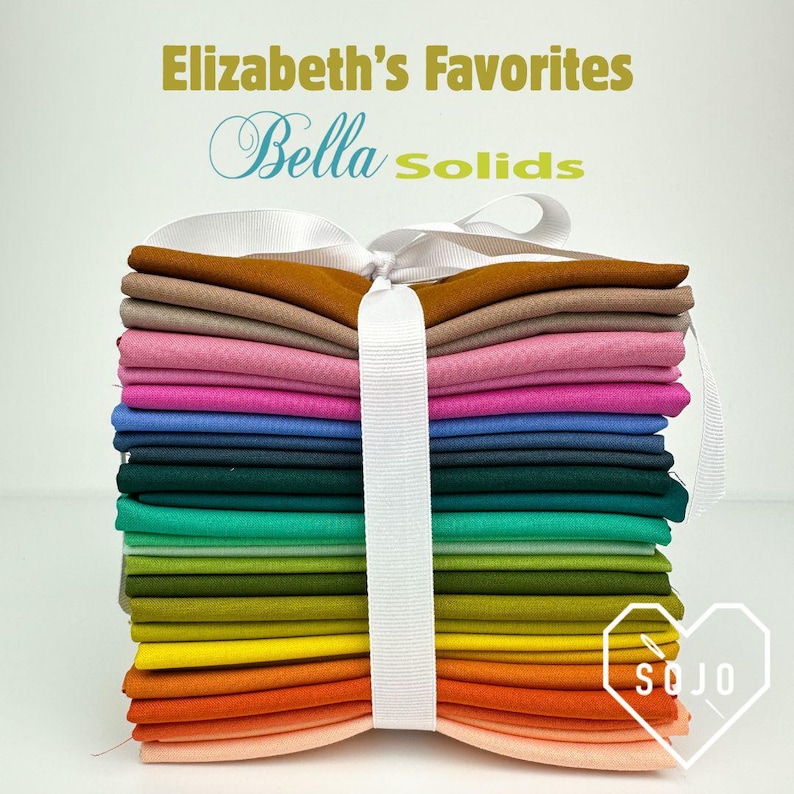 May include: A stack of colorful fabric squares, tied with a white ribbon. The fabrics range in color from light peach to dark teal, with text that reads "Elizabeth's Favorites Bella Solids". The SOJO logo is in the bottom right corner.