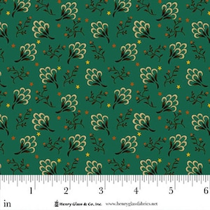 May include: Green fabric with a repeating pattern of beige floral shapes, brown branches with orange berries, and yellow stars. The fabric has a ruler along the bottom edge with measurements in inches.