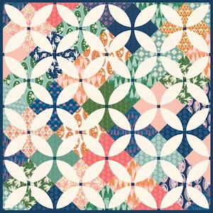 May include: A white quilt with a repeating pattern of overlapping circles in a floral fabric. The fabric features a variety of colors, including pink, blue, green, and yellow.