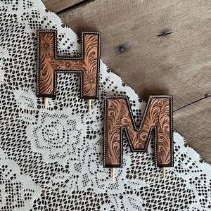 Tooled leather cake topper