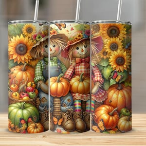 May include: Three stainless steel tumblers with a fall design. The design includes scarecrows, pumpkins, sunflowers, and butterflies. The tumblers have a straw and are decorated with vibrant colours, ideal for autumn.