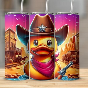 May include: A yellow rubber duck wearing a brown cowboy hat with a sheriff's star, a red bandana, and holding a silver pistol. The duck is standing in a desert scene with a saloon in the background.