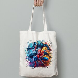 May include: A white canvas tote bag with a colorful graphic print of Spider-Man and Venom. The image features the two characters in a dynamic pose with splashes of blue, red, orange, and yellow paint.