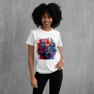 May include: White t-shirt with a colorful graphic print of Spider-Man and Venom fighting. The graphic is in a dynamic pose with splashes of red, blue, and purple paint.