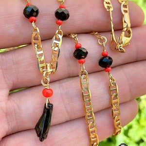 Gold baby bracelet with black fist store