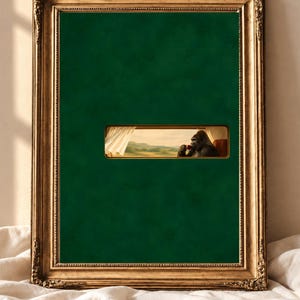 May include: A rectangular wall art piece in an ornate gold frame featuring a solid dark green background with a small horizontal window cutout. Through the window, a gorilla sits in a chair drinking from a red cup, looking out at a landscape.