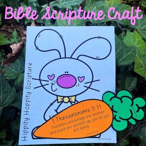 May include: A blue bunny with a pink nose and a yellow bow tie holds a carrot with the Bible verse "1 Thessalonians 5:11 Therefore encourage one another and build one another up, just as you are doing." printed on it.