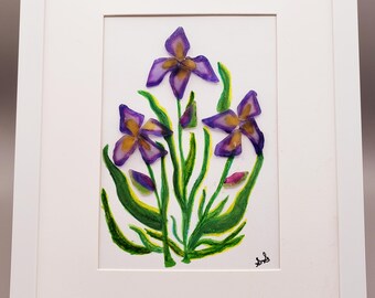 May include: A framed artwork featuring a cluster of purple and yellow irises with green leaves, painted in a watercolor style.