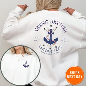 May include: White sweatshirt with a blue anchor graphic and the text "Cruisin' Together" with stars and the text "Custom Text Your Location".