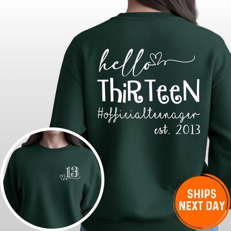 a green sweatshirt with white text on the back. The text reads "Hello Thirteen Official teenunamer est. 2013" and there is a number "13" on the front. The sweatshirt appears to be a gift or merchandise item.