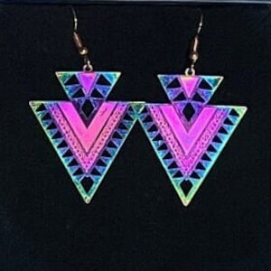 May include: A pair of iridescent triangle earrings with a geometric pattern. The earrings are made of metal and have a gold finish.