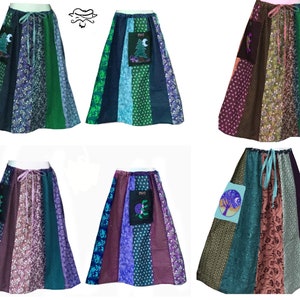 May include: Six patchwork skirts with different patterns and colors. Each skirt has a pocket with an embroidered design of a tree and moon. The skirts are all made of cotton fabric and have a drawstring waist.