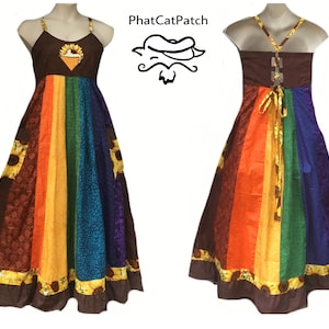 May include: A long, rainbow-striped dress with a brown bodice and sunflower print. The dress has a tie-back closure and a sunflower print on the bodice.
