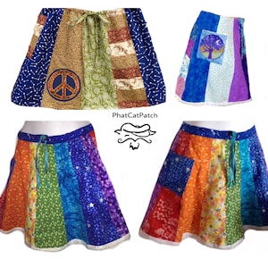 May include: Four patchwork skirts with a tie waist. The skirts are made of different fabrics with various patterns, including floral, paisley, and geometric designs. The skirts are all different colors, including blue, green, orange, red, and purple. The skirts are all different lengths, but they are all above the knee. The skirts are all made with a white lace trim.