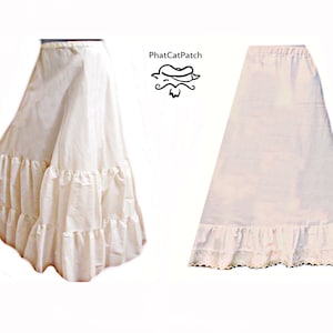 May include: Two white cotton petticoats with ruffles. The petticoat on the left has three rows of ruffles. The petticoat on the right has a scalloped lace trim.