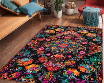 May include: A colorful rug with a geometric pattern in shades of pink, orange, yellow, green, and blue on a black background.