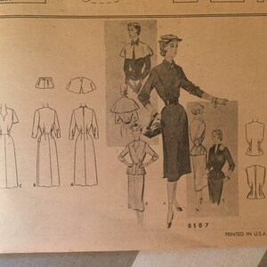 May include: A vintage sewing pattern for a dress with a fitted bodice and a full skirt. The pattern includes instructions for making a variety of styles, including a dress with a cape, a dress with a fitted bodice, and a dress with a full skirt. The pattern is printed on a light brown paper with black ink. The pattern number is 8587. Printed in U.S.A.