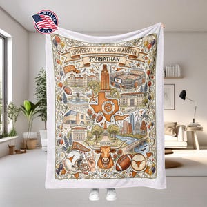 May include: A white blanket featuring a detailed illustration of the University of Texas at Austin, including landmarks, a map of Texas, and the text "UNIVERSITY OF TEXAS AT AUSTIN JOHNATHAN". The blanket has a decorative border and is made in the USA.