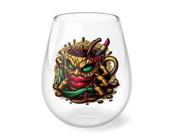 May include: A clear glass wine glass featuring a graphic of a coffee cup with a face, green hair, and red lipstick. The coffee cup is spilling coffee and has a lipstick stuck in it. The text "Made in China" is printed on the bottom of the glass.