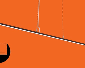 May include: A long, thin, black pendant light fixture hangs from the ceiling. The light is suspended by two thin wires. The light fixture is angled slightly downward.