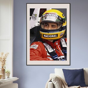 May include: A close-up of a race car driver wearing a yellow and red helmet with the word "HONDA" and "Marlboro" on it. The driver is wearing a red racing suit with the word "BOSS" on it. The driver is looking to the right.