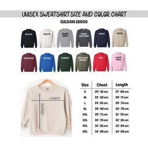 May include: A size and color chart for unisex sweatshirts. The chart displays various sweatshirt colors, including black, white, and navy. Measurements are provided in inches and centimeters for chest and length, ranging from size S to 5XL.