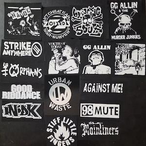 May include: A collection of black and white fabric patches featuring various band logos and graphics, including The Havoc, Zounds, Bouncing Souls, GG Allin, Strike Anywhere, Youth of Today, A Global Threat, The Orphans, Good Riddance, Urban Waste, Against Me!, In-DK, 98 Mute, Stiff Little Fingers, and Mainliners.