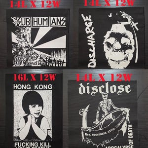 May include: Four black fabric patches with white screen-printed graphics. Top left: Subhumans Religious Wars, 14L x 12W inches. Top right: Discharge skull, 14L x 12W inches. Bottom left: Hong Kong Fucking Kill Your Family, 16L x 12W inches. Bottom right: Disclose Das Nightmare Still Continues, 14L x 12W inches.