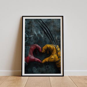 May include: A red and yellow superhero glove pair forming a heart shape against a dark, textured background. The text "He said yes" is visible in the background.