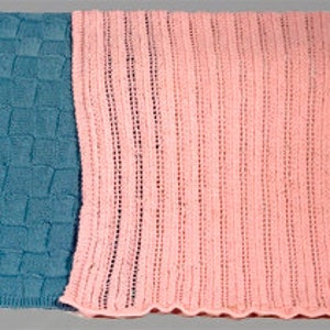 May include: Two knitted blankets, one blue and one pink, are sewn together. The blue blanket has a textured pattern and the pink blanket has a smooth, striped pattern.