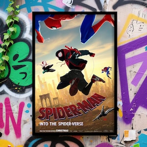 May include: A framed movie poster for "Spider-Man: Into the Spider-Verse" featuring multiple Spider-Man characters in action poses. The poster has a cityscape backdrop and the film's title in large, red letters. The words "Christmas" and "Only on the Big Screen" are also visible.