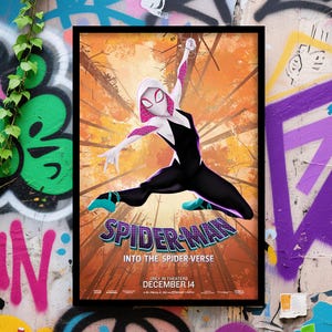 May include: Framed movie poster for "Spider-Man: Into the Spider-Verse." The poster features Spider-Gwen in a dynamic pose against a backdrop of an orange and brown forest. The title and release date are prominently displayed in the lower section.